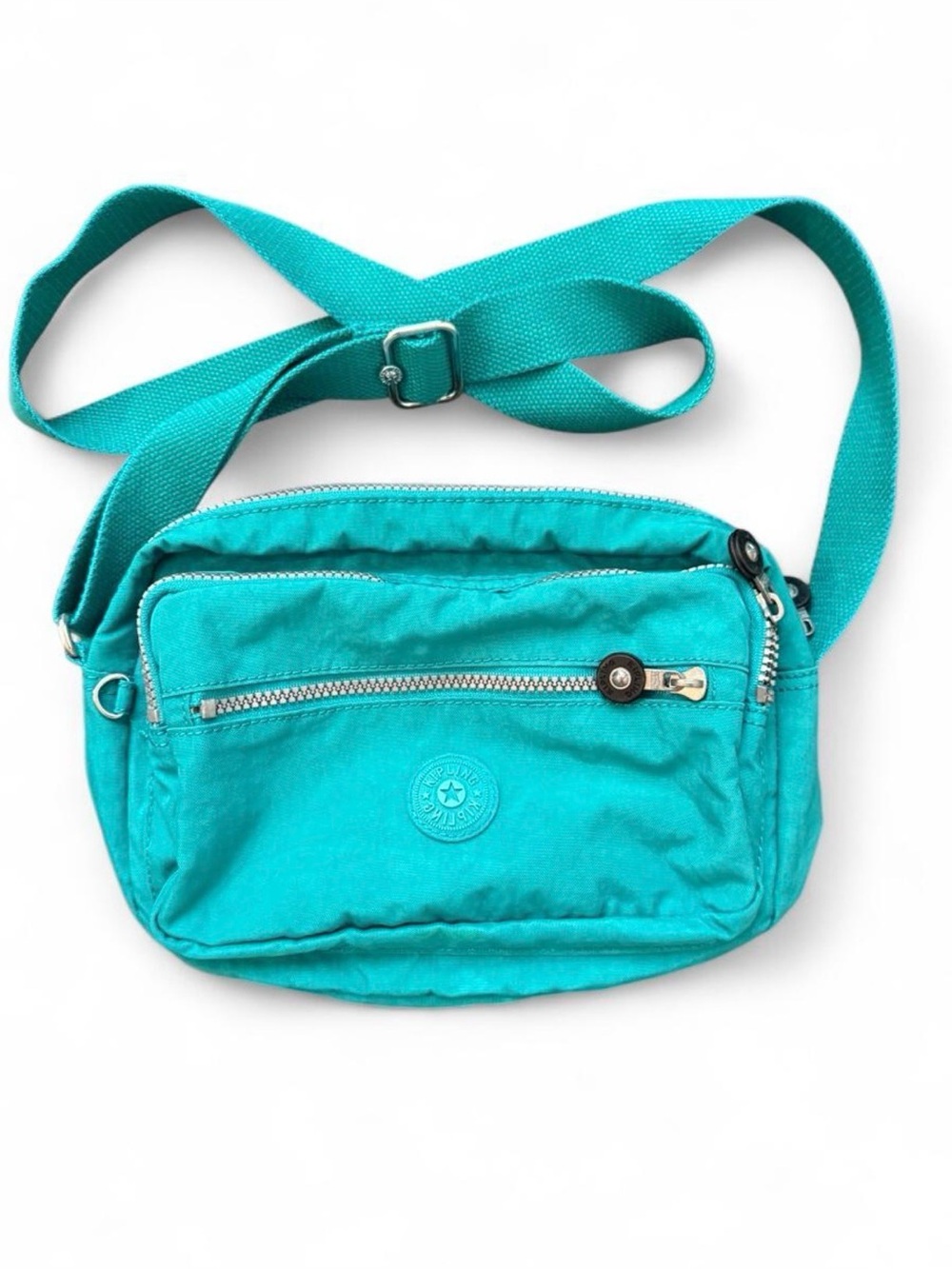 KIPLING  teal crossbody/shoulder bag with multiple zip compartments.